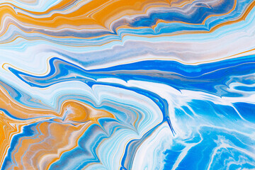 Obraz premium Fluid art texture. Abstract backdrop with swirling paint effect. Liquid acrylic artwork with flows and splashes. Mixed paints for posters or wallpapers. Blue, orange and navy blue overflowing colors