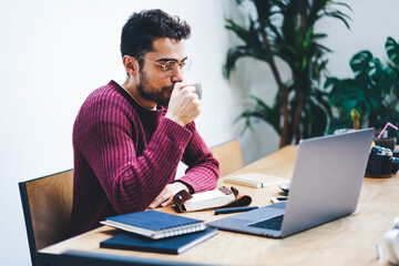 Fototapeta premium Copy space area for advertising text message. Guy freelancer webinar on laptop