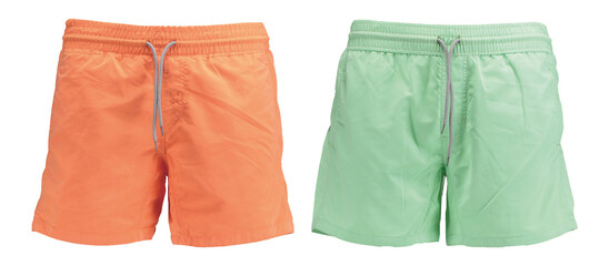 Couple of classic men’s swimwear Sports Quick Dry. Beach orange and green shorts Bermudas. Front view. Isolated image on a white background.