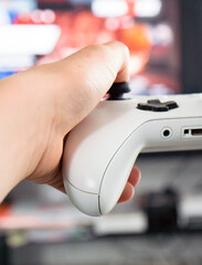 young boy playing console games