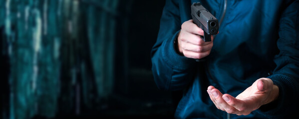 Terrorist thief man holding short gun in his hand
