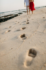 footprints in white sand at sea. High quality photo