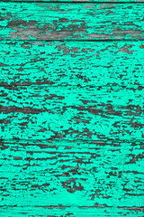 Fototapeta na wymiar turquoise wall from vertically and horizontally laid boards