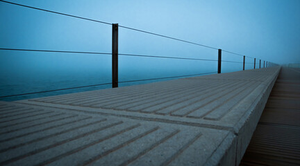 Seafront promenade with intense fog