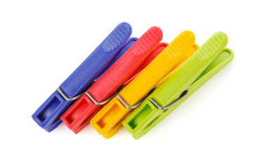 Color plastic clothespins isolated on white background. Plastic clips. Close-up.