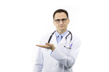 Fototapeta premium Handsome serious male doctor in medical uniform holding empty palm showing to copy text space on isolated white background. Health, healthcare, medicine recommendation, insurance, clinic ads concept
