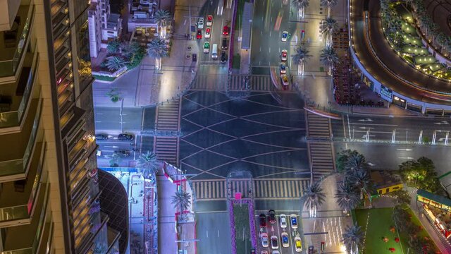 night illuminated dubai city center famous traffic street crossroad rooftop panorama timelapse 4k united arab emirates  