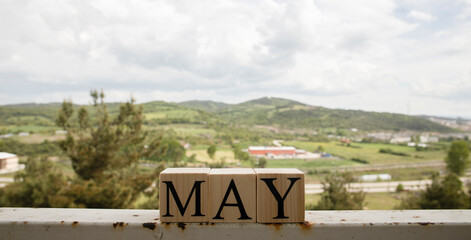 The word may from wooden cubes. Spring concept.