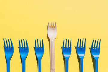 Wooden cutlery set, wooden chopsticks and plastic forks. Reusable - sustainable products for indoor and outdoor use. wooden VS plastic. save the world and environment,Plastic free concept.