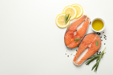 Composition with salmon meat and spices on white background, top view