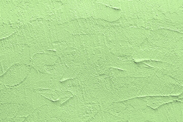 Green stucco texture. Architectural abstract background. Pistachio wall of building.