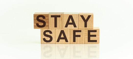 The wooden blocks say STAY SAFE. Concept image a wooden block and word - STAY SAFE.