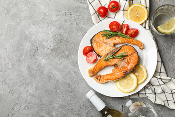 Composition with tasty grilled salmon on gray background, top view