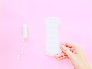 Intimate feminine hygiene products. The daily tampon and sanitary pads. Menstrual cycle.