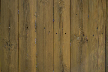 The texture of the wooden fence is light brown.