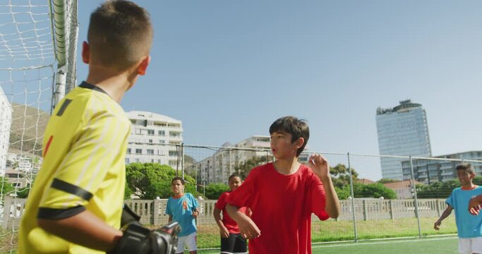 Soccer kids playing in a sunny day