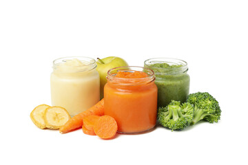 Glass jars with healthy baby food isolated on white background
