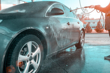 Vehicle clean service. Hand wash auto from water soap. Foam car washer on cleaner station. Care with pressure wax.