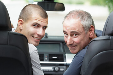 confident young salesman with happy customer