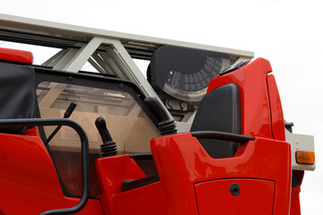 The workplace of the operator control the retractable ladder of the fire truck.