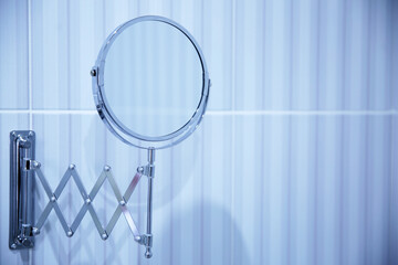 Round mirror in the bathroom. Abstract bathroom background. Photo Close-up