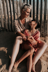 lovely moment mother and daughter at the beach