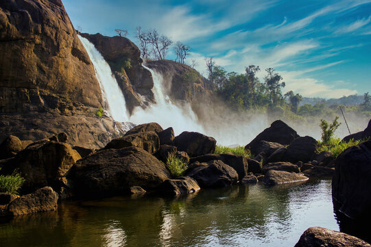 A landscape view of a waterfall named Athirapally