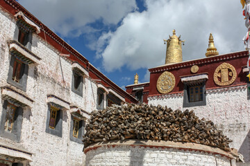 Drepung monastery buildings and log storage near Lhasa, Tibet, Asia