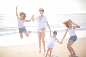 family having fun at the beach