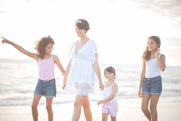 family walks at the beach