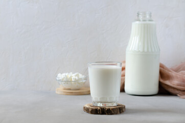 Homemade fermented beverage in a glass - kefir, cottage cheese, on a white background. Sour milk drink, yeast for yeast bacterial fermentation, intestinal health concept. Fashionable food and drinks
