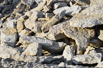 Stack of limestone. big crushed limestone stone. broken sandstone close-up