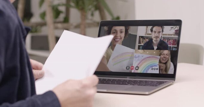 Group on video call showing Rainbow drawing to thank essential workers during the Coronavirus Pandemic