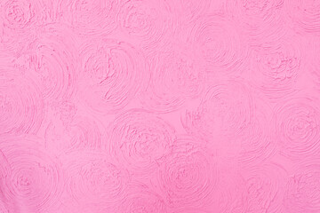 Beautiful pink background with stucco flowers. Copy space