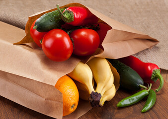 Fruits and vegetables in paper bags made from recycled paper.