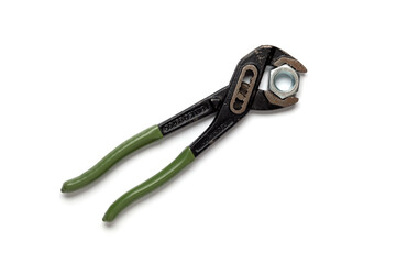 Adjustable plumber wrench holding hexagonal nut isolated