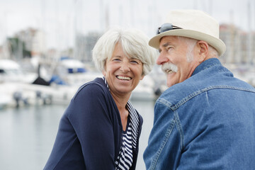 portrait of senior couple at a harbour