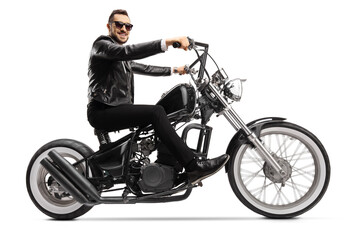 Obraz na płótnie Canvas Handsome man biker on a custom chopper