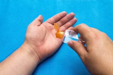 Applying antibacterial gel on the hands.