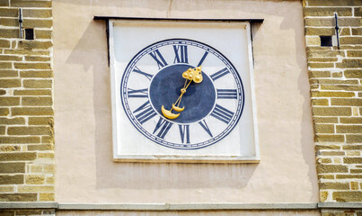 Fototapeta premium Old tower clock with roman numbers at catholic church in Ptuj, Slovenia.