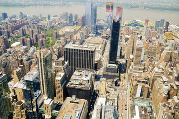 A view from Empire State Building over numerous skyscrapers at Manhattan in New York City, USA.