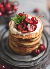  Breakfast Pancakes with  Cherries, Homemade American pancakes served withfresh cherry on a wooden background, sweet dessert 