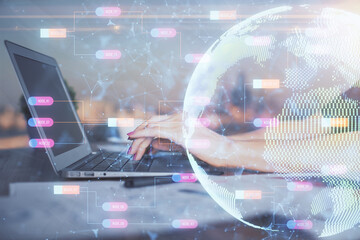 Double exposure of woman hands working on computer and world map hologram drawing. International technology business concept.