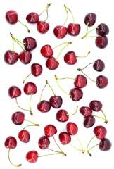 Pattern of ripe red cherries. Fresh cherries  on a white background. Top view.  
