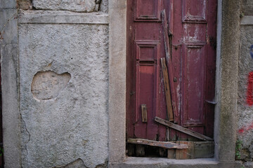 Fragment of the facade of an abandoned house in the old center of Porto, Portugal.