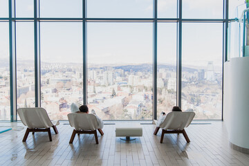 The man is relaxing after a spa. The guy after the massage. A man is resting in a massage after a bath. A man Lies on a lounger in an indoor pool. The man is sleeping after work.