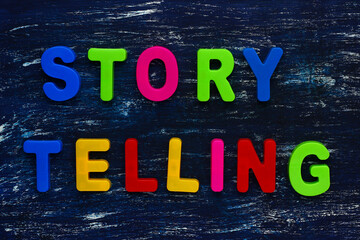 Text made in multicolored magnetic letters. STORY TELLING.