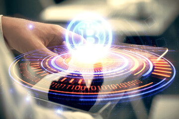Double exposure of man's hands holding and using a phone and crypto currency blockchain theme...