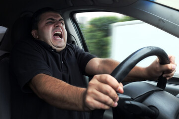 Angry man driver dangerously driving car without seat belts