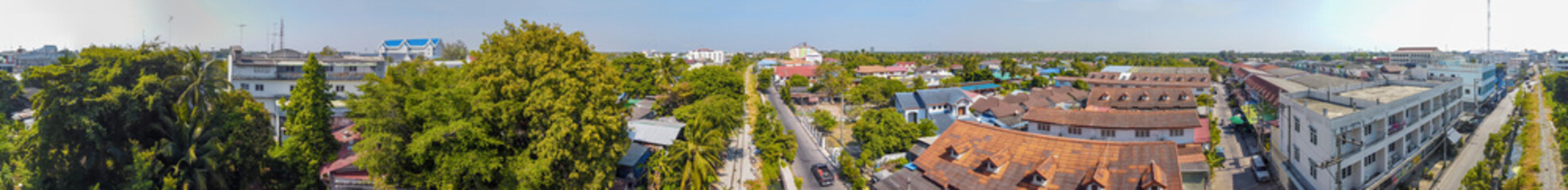 MAEKLONG, THAILAND - DECEMBER 15, 2019: Panoramic aerial view of famous railway market and city skyline